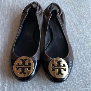Tory Burch flats with black patent toe and gold embellished Tory logo